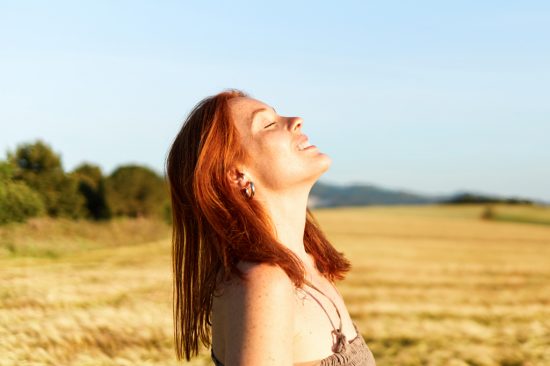 cheerful-red-haired-girl-breathing-relaxed-in-a-wh-2022-04-06-05-21-15-utc